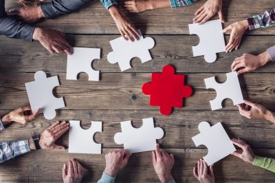 Hipster business successful teamwork concept, business group assembling jigsaw puzzle